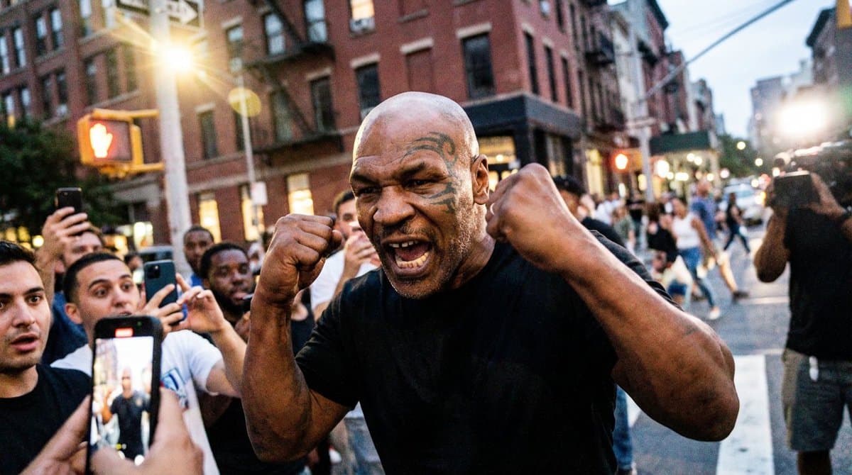 Legendary heavyweight boxer Mike Tyson, shaved head, iconic-style face patter...
